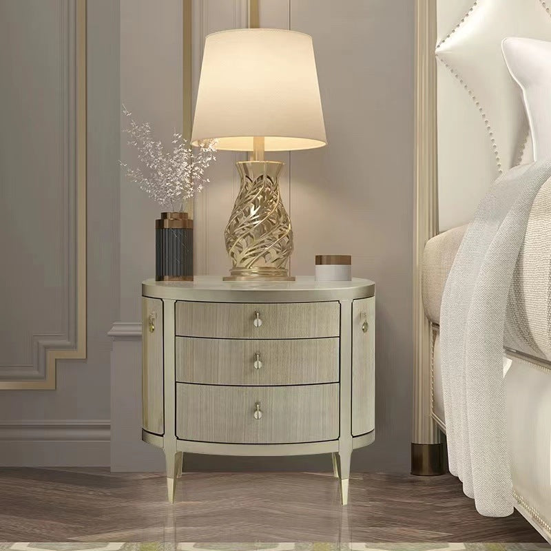 Curved Nightstand with Gold Accents and Elegant Design