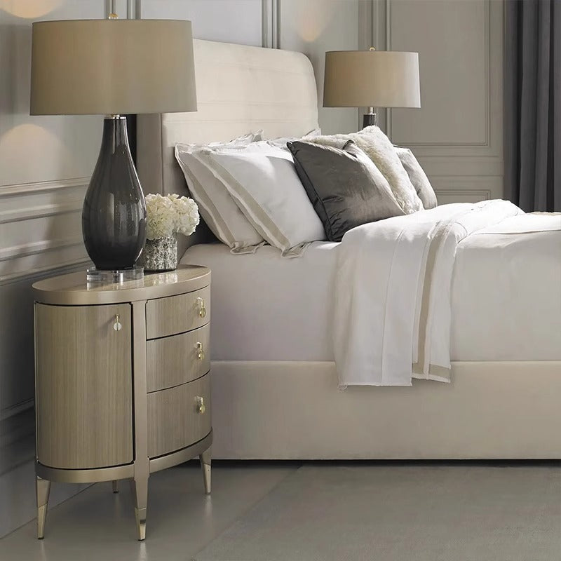 Curved Nightstand with Gold Accents and Elegant Design