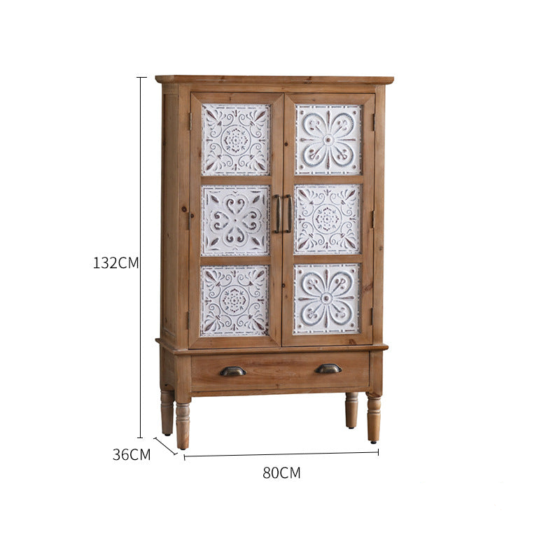 The Rustic Sideboard and Wall Shelf Set by Furnishaus - Home and Living features timeless design with ornate white panel doors featuring floral patterns. It stands on four legs, showcasing quality craftsmanship with two metal handles and a pull-out drawer. Dimensions: 132 cm high, 80 cm wide, 36 cm deep.